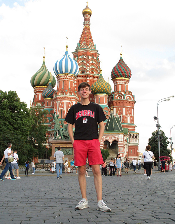 Alex Buie standing in front of an ornate building in Russia