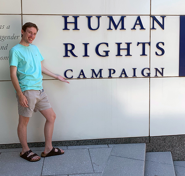Jake Strickland standing in front of the Human Rights Campaign headquarters