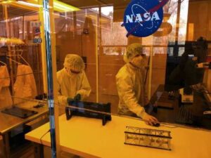 Two people work in a NASA area.