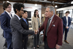 (L-R) UGA students Jack Giglio, Buhusuru Ranasinghe, Lee Tran, Jessica Tardy, and Elizabeth Quilliams greet owner and founder Arthur Blank of the Blank Family of Businesses at the Innovation Hub.